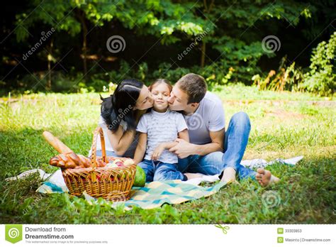 Mother And Father Kissing Daughter Stock Image Image Of