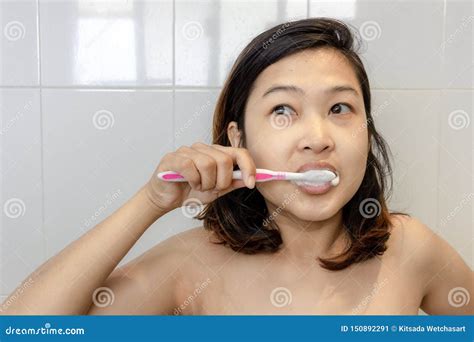 young asian woman brushing teeth   morningwith healthy teeth concept stock image image