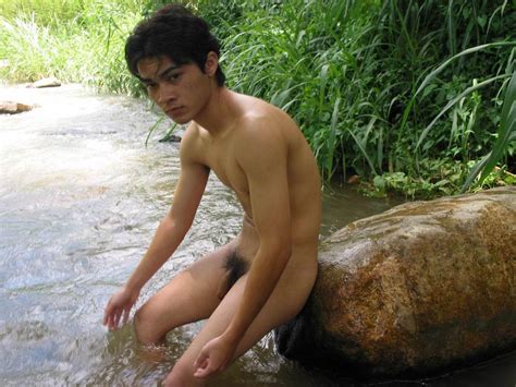 asian guy naked on the big rock in the stream movie shark