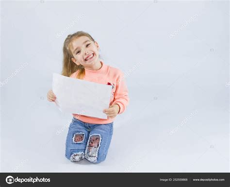 girl holding sheet white paper stock photo  csolyaris