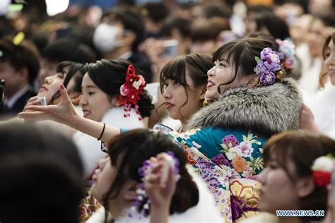 japanese girls dressed up celebrate coming of age at tokyo disneyland