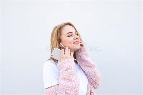blonde teen girl listening to music stock image image of jeans adult 226577
