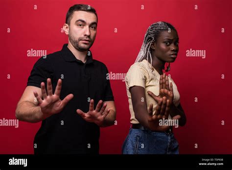 portrait of shocked interracial couple african woman and caucasian man