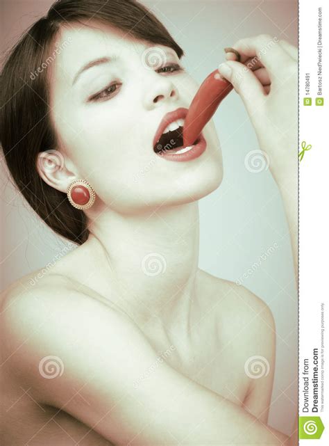 retro shot of a woman biting a chili pepper stock image image of face isolated 14780491