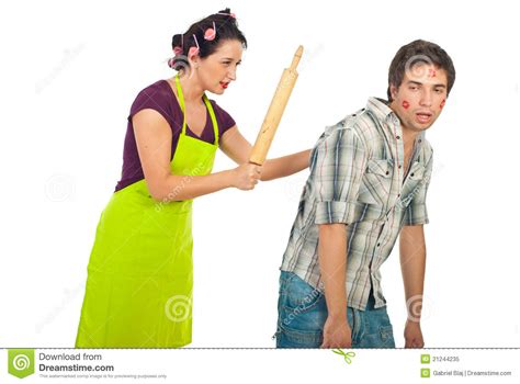 angry wife beat her drunk unfaithful husband stock image