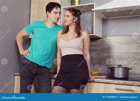 Young Woman Is Flirting With Man In Kitchen Stock Image Image Of