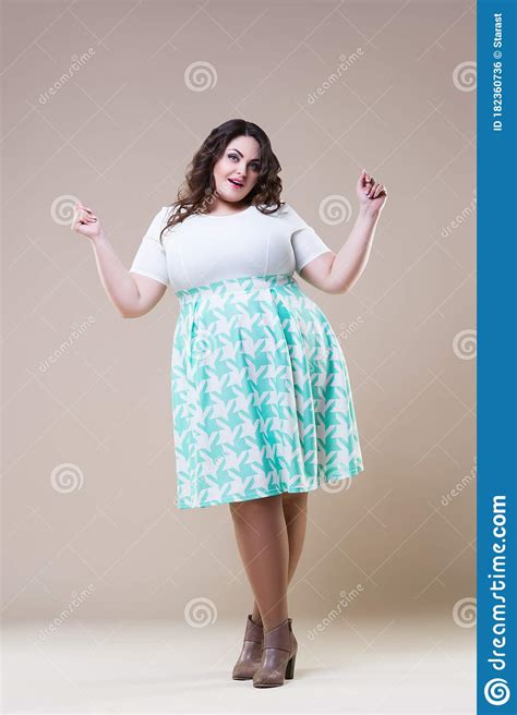 Happy Plus Size Fashion Model In Casual Clothes Fat Woman On Beige