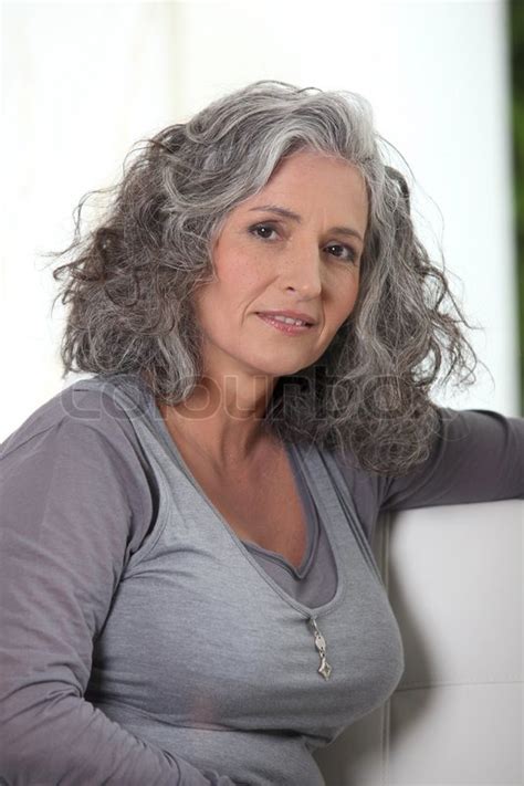 grey haired retired woman has a lot of stock image colourbox