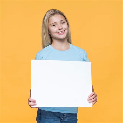 photo smiley girl holding blank paper sheet