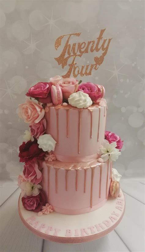 2 tier 24th birthday cake with artifitial flowers and macarons 15th