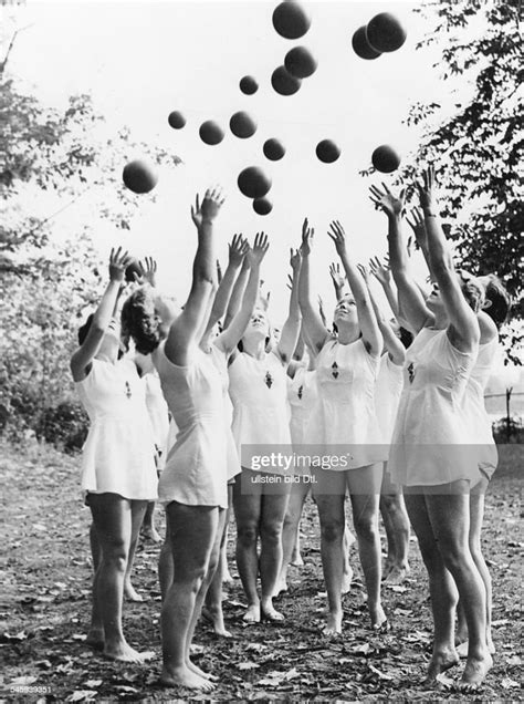 members of the league of german girls doing exercises with balls in