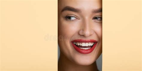 Woman With Perfect Smile And Red Lips Looking Into Hole Stock Image