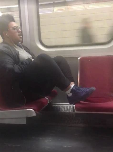 woman teaches passenger who put his feet up on train seat a lesson by sitting on him mirror