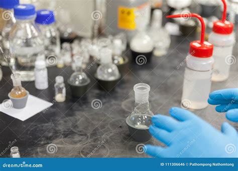 scientist working  laboratory mixing liquids stock photo image  caucasian concentration