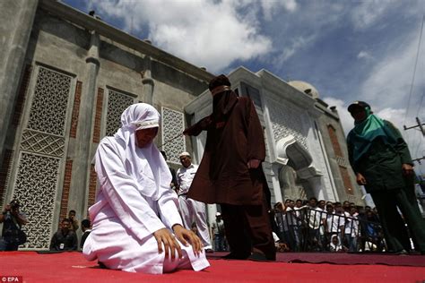 unmarried couples are flogged for violating sharia law in