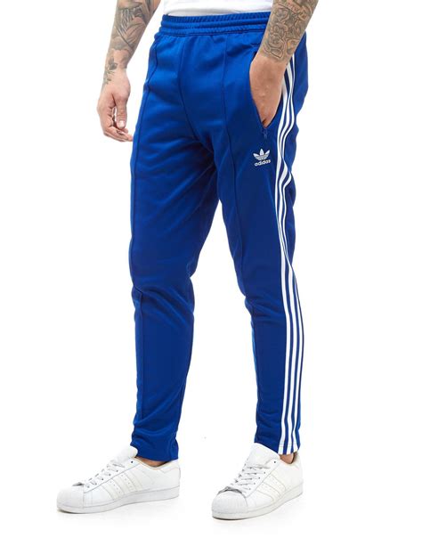 lyst adidas originals bb track pants  blue  men