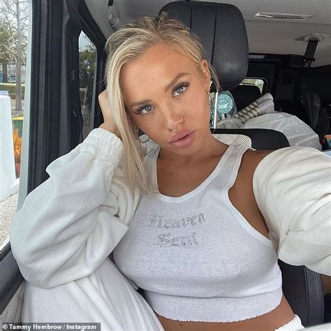 tammy hembrow raises eyebrows as she goes braless in a tiny crop top