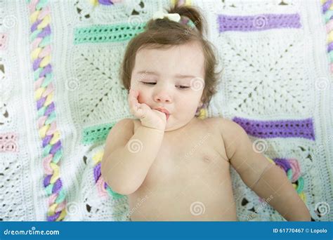 girl suck up milk at car seat and fasten seat belt royalty free stock