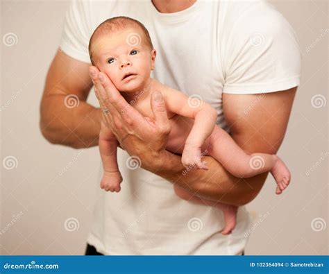 father holding  born baby   arm stock photo image  parent