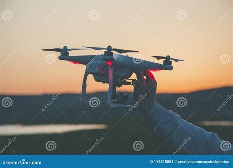 photo  person holding drone picture image