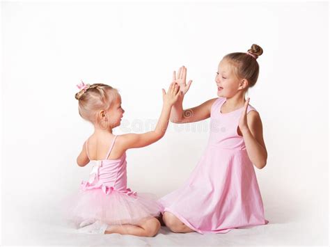 Girls Young Ballerinas In Pink Dresses On A Light Background Stock