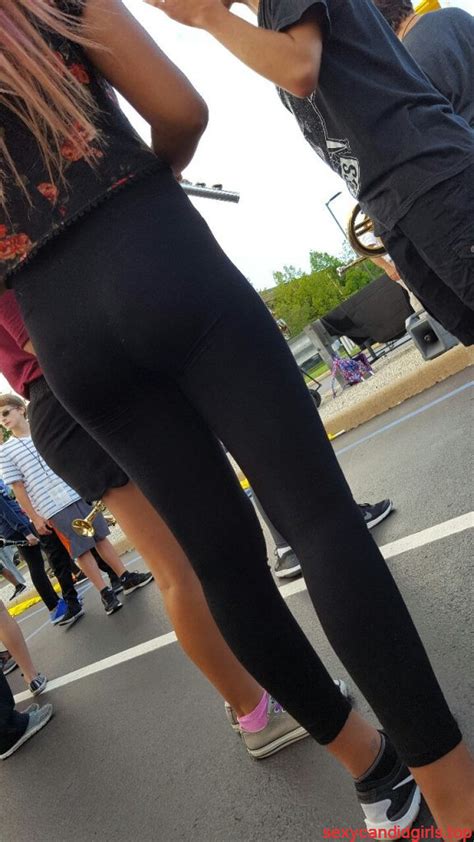 skinny teen in tights on the street booty and legs closeup
