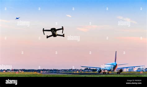 unmanned drone flying  runway  airport  commercial airplane takes  leading