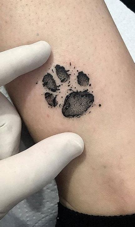 Small Paw Print Tattoo With Initial