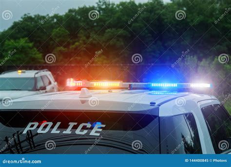 blue flashing   police car   chase  cars royalty  stock photo