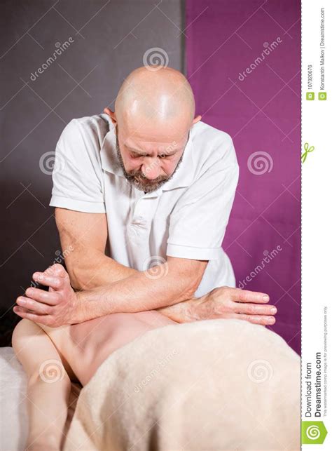 Masseur Hands Doing Spine And Back Massage Neck And Hand Relaxed
