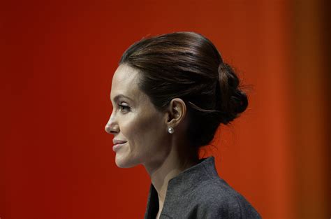 queen elizabeth makes angelina jolie a dame time