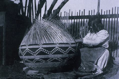 pomo woman weaving an enormous close twine basket native american