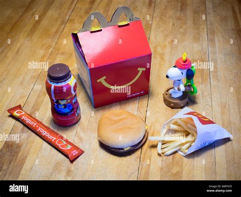 a mcdonald s happy meal with a cheeseburger french fries chocolate