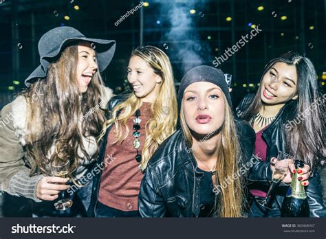 Group Of Four Pretty Girls Having Party Smoking And