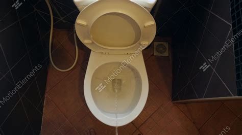 point of view man pee in the toilet at home urinal in
