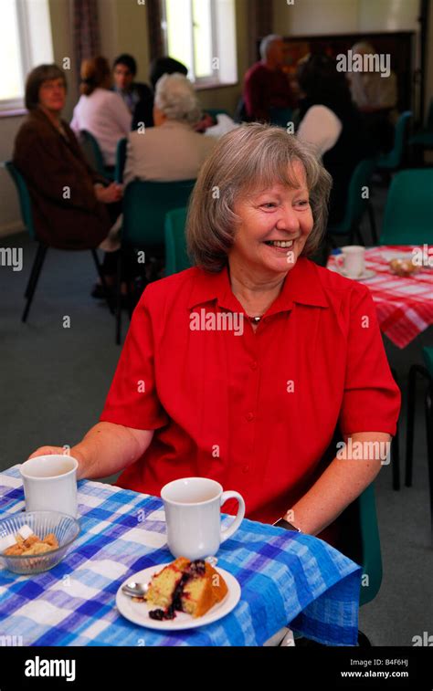60 Year Old Woman Enjoying A Coffee Morning Which Aimed To Raise Funds