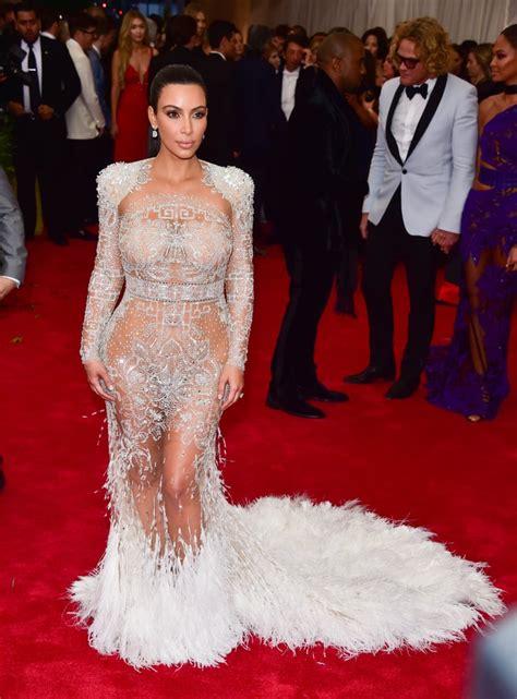 kim kardashian adorned her curves with feathers and embellishments in