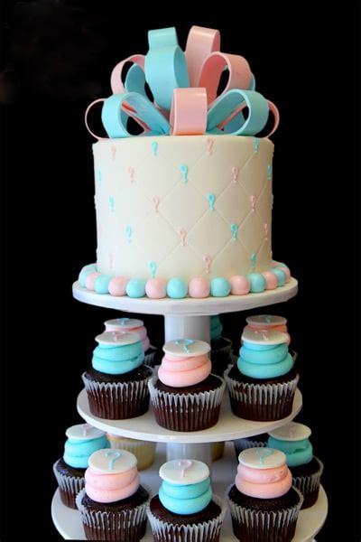 pink and blue cupcake stand gender reveal party cakes