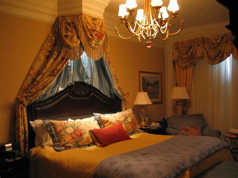 large bed sitting   chandelier   bedroom    lamps