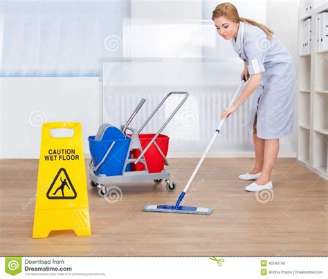 happy maid cleaning floor with mop stock image image of