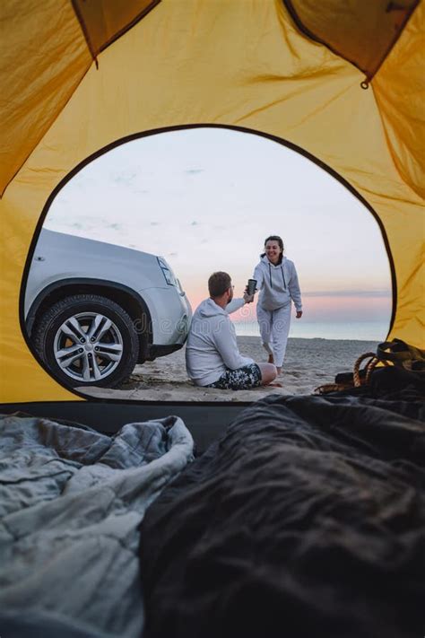 Couple Meeting Sunrise At Sea Beach View Through Camping Tent Stock