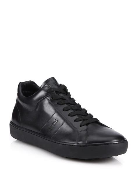 tods solid leather sneakers  black  men lyst