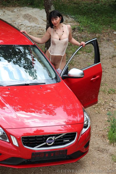 desyra noir teasing with her amazing body by the car outdoors photos