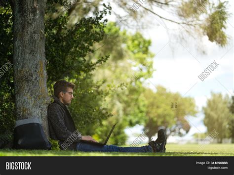 man sitting  tree image photo  trial bigstock