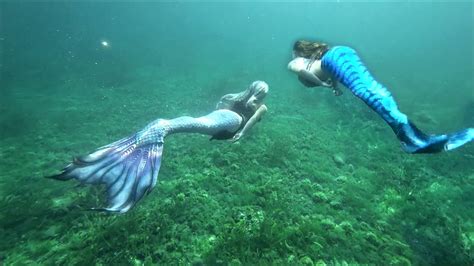 fantasy mermaids mermaid sisters swim   magical waters  lake
