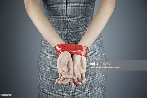 woman with hands tied behind back photo getty images