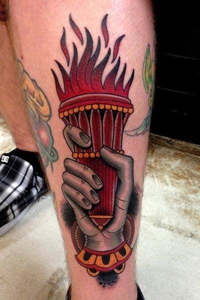 fire torch tattoo meaning and symbolism tattooswin