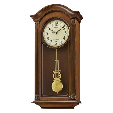 gold tone arched wall clock  pendulum  dual chimes