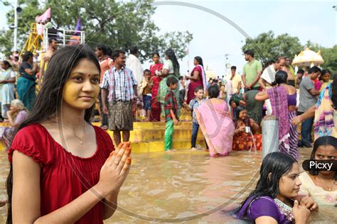 Image Of Indian Hindu Girl Devotees Taking Holy Bath In River Krishna