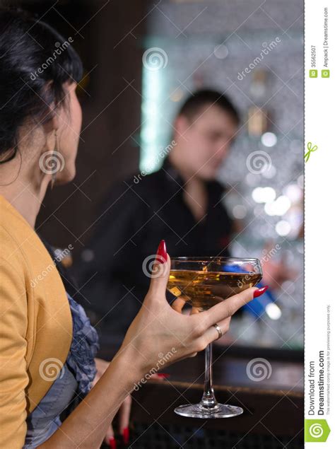 elegant woman drinking a martini cocktail stock image image of